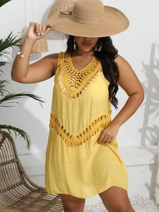 Detail of hand-crocheted neckline and waist cut-outs on yellow beach cover-up dress