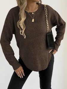 Detail of dark brown knit sweater with a round neck and irregular curved hemline
