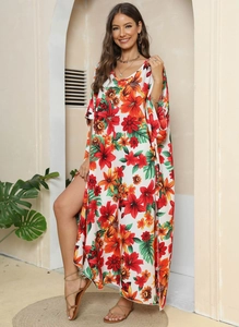 Detail of floral print maxi dress with high slit and wide batwing sleeves for vacation