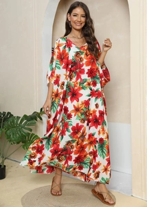 Detailed view of the V-neckline and vibrant floral print on the long maxi dress