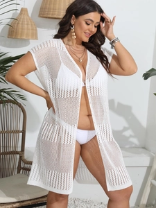 Close-up detail of white crochet mesh texture on beach bikini cover-up for women