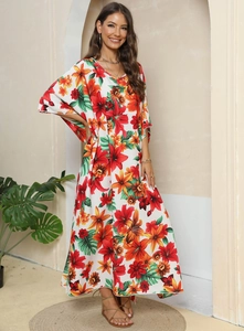 Detailed view of the vibrant floral print and lightweight fabric on this beach maxi dress