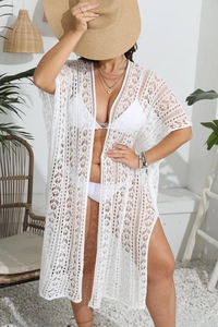 Détail d'un cache-maillot blanc au crochet avec motif géométrique ajouré élégant