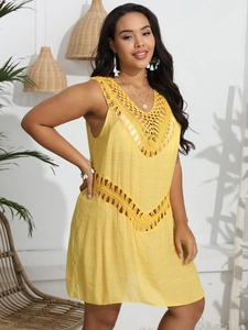 Detail of yellow hollow crochet knit cover-up dress with V-neck and mesh texture