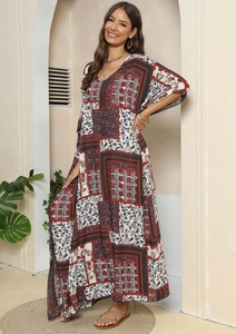 Detail of bohemian floral patchwork print on a lightweight long sleeve maxi dress