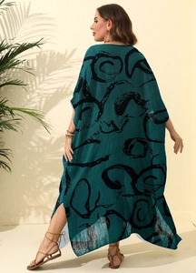 Detail of loose ink print beach kaftan dress with back slit in dark green chiffon
