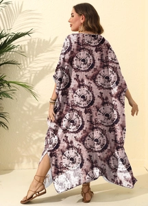 Detail of swirl print kaftan maxi dress with side slit and loose fit beach style