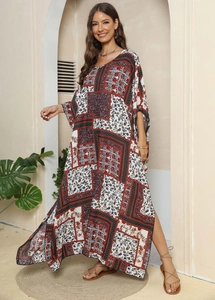 Detail of bohemian floral print maxi dress featuring elegant V-neckline and loose batwing sleeves