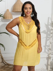 Detailed view of the yellow crochet hollow-out design on a bohemian beach cover-up dress