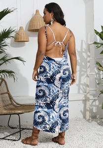 Detail of blue tie-dye maxi dress featuring open back design and delicate crisscross straps