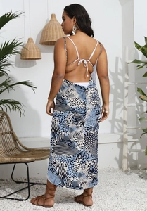 Detail of cross-back leopard print maxi dress with tie-up back and zebra pattern design