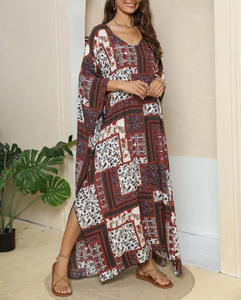 Detail of bohemian floral print maxi dress featuring elegant V-neck and side slit design