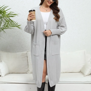 Close-up of light grey oversized knit cardigan with practical large side pockets