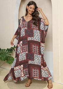 Detail of bohemian floral print maxi dress with deep V-neck and batwing sleeves