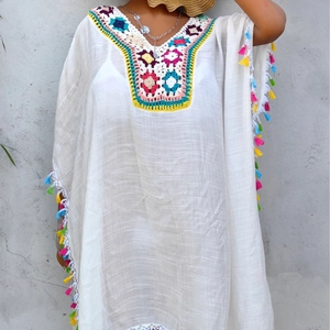 Bohemian white crochet beach dress with colorful floral embroidery and fringe tassels