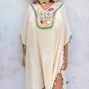Beige bohemian crochet beach dress with colorful floral embroidery and tassel fringe details