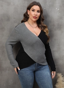 Detail of the gray and black color-block knit sweater with a deep V-neck wrap design