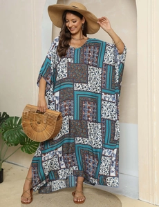 Close-up of bohemian floral print and lightweight fabric on this long V-neck kaftan dress