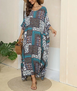 Detail of ethnic floral print kaftan maxi dress with V-neck and flowing wide sleeves