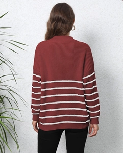 Detail view of the back of a burgundy striped knit sweater with loose-fit design