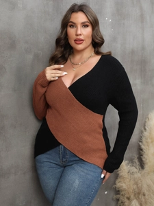 Detailed view of the wrap V-neckline and two-tone color block knit fabric for plus size sweater