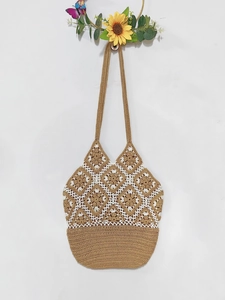 Retro hand-crocheted shoulder bag with geometric hollow patterns and earthy brown weave