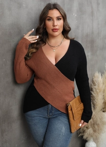 Detail of plus size color block knit sweater with deep V-neck and crisscross design