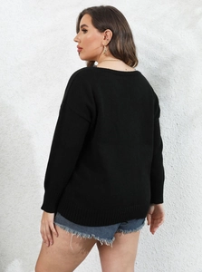 Detail view of the ribbed knit texture and back design of a black V-neck sweater for women