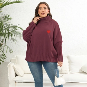Detail of burgundy oversized turtleneck sweater with a red heart embroidery on the chest