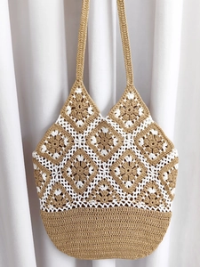 Handmade crochet tote bag with khaki geometric patterns and dual handles for summer vacations