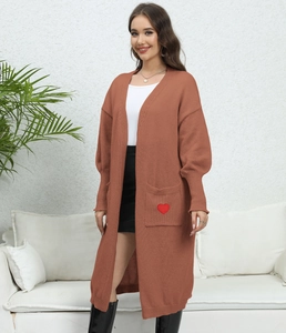 Rust red long knit cardigan with lantern sleeves and heart embroidery on the pocket