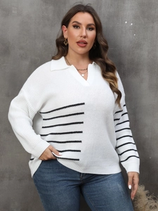 Detail of V-neck collar and black striped pattern on white plus size knit sweater