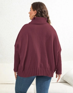 Detailed back view of burgundy oversized turtleneck sweater with ribbed cuffs and hem
