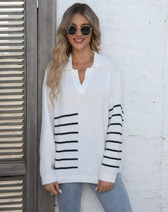 Detailed close-up of striped polo collar knit sweater with V-neckline on a female model