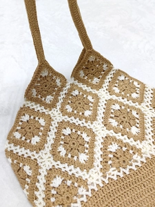 Handmade crochet granny square tote bag in brown and white contrast patchwork floral design