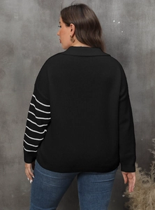 Detail of white stripes on a black plus size knit sweater sleeve with back view on model
