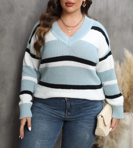 Detail of V-neck and color-block striped knit pattern on oversized women sweater