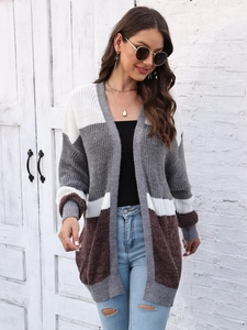 Detail of color-block knit cardigan texture showing premium thick stitching and soft finish