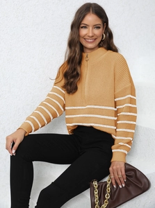 Detail of knit stripe sweater with high neck zipper and ginger yellow texture