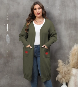 Detailed view of women's long cardigan featuring red heart embroidery on front pockets
