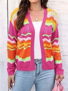Close-up detail of crochet knit texture on colorful rainbow striped cardigan sweater