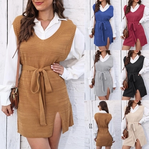 Detail view of the V-neck knitted vest dress with side slit and waist tie feature