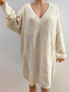 Off-white oversized V-neck knit dress featuring classic cable knit patterns and loose fit