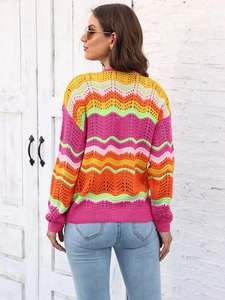 Close-up of rainbow striped knit cardigan featuring wave texture and colorful patterns