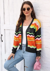 Detail of colorful wavy striped knit cardigan with vibrant crochet texture and open front