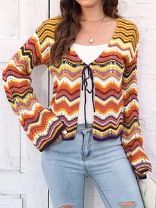 Detail of colorful wavy striped knit cardigan with front tie closure and flare sleeves