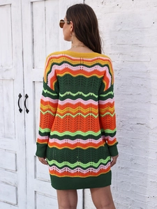 Macro shot of colorful wave-pattern crochet texture on a long-sleeve knit mini dress
