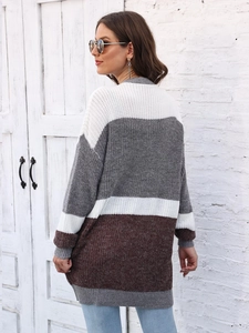 Detailed back view of color-block oversized knit cardigan in white grey and brown