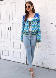 Detail view of rainbow wavy textured knit cardigan with blue and green striped pattern