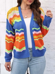 Detailed close-up of wave-patterned crochet knit cardigan with colorful rainbow stripes